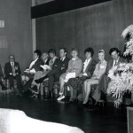 Group of adults sitting in chairs